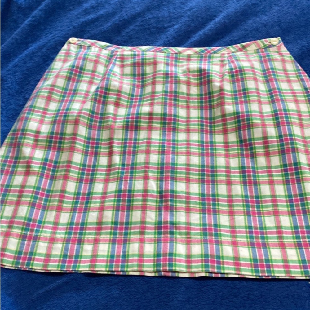 Plaid Tommy skirt with buttons on both sides.  Size 14